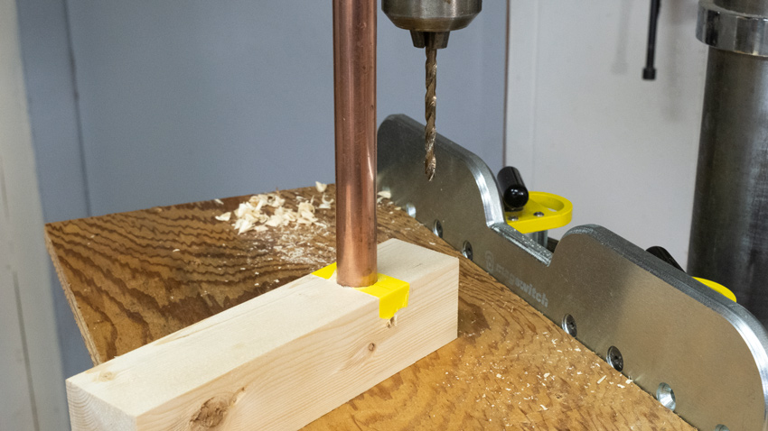 Drilling pipe into wood