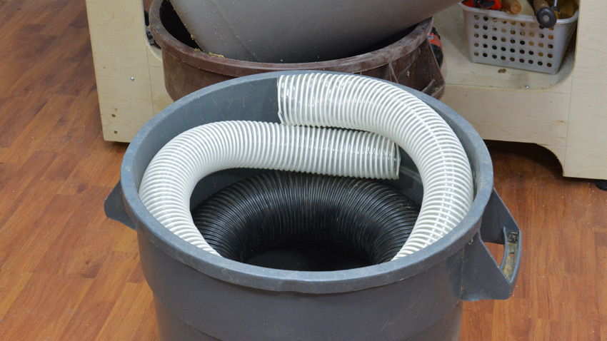 Dust collector hose storage
