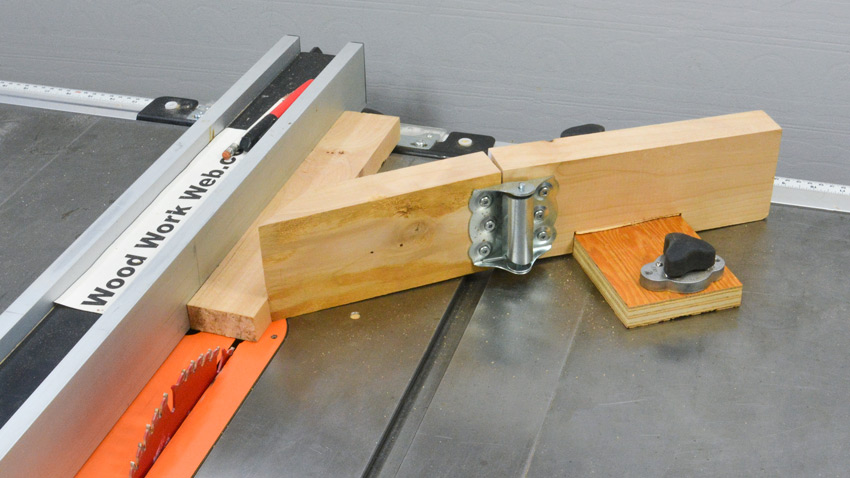 Spring hinge for a feather board