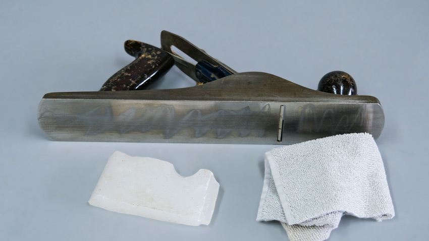 Waxing woodworking plane